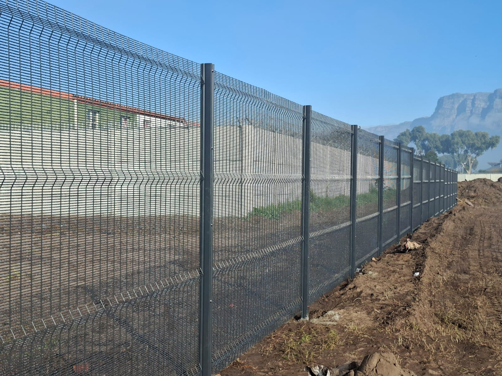 Galvanized and epoxy-coated ClearView panels with Table Mountain beyond