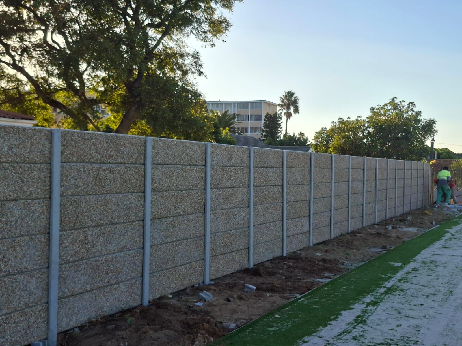 Pebble Vibracrete panels along the completed boundary