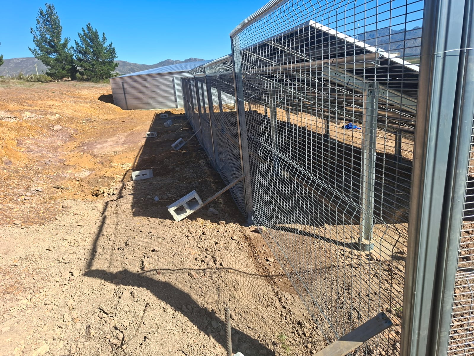 ClearView fence enclosing solar arrays on a Vyeboom farm