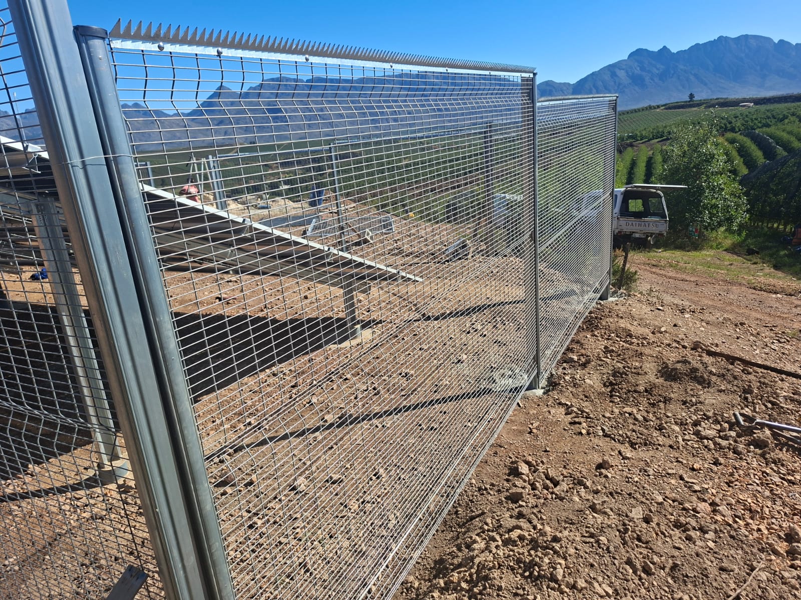 2.1m galvanized ClearView panels with mountain backdrop in Vyeboom