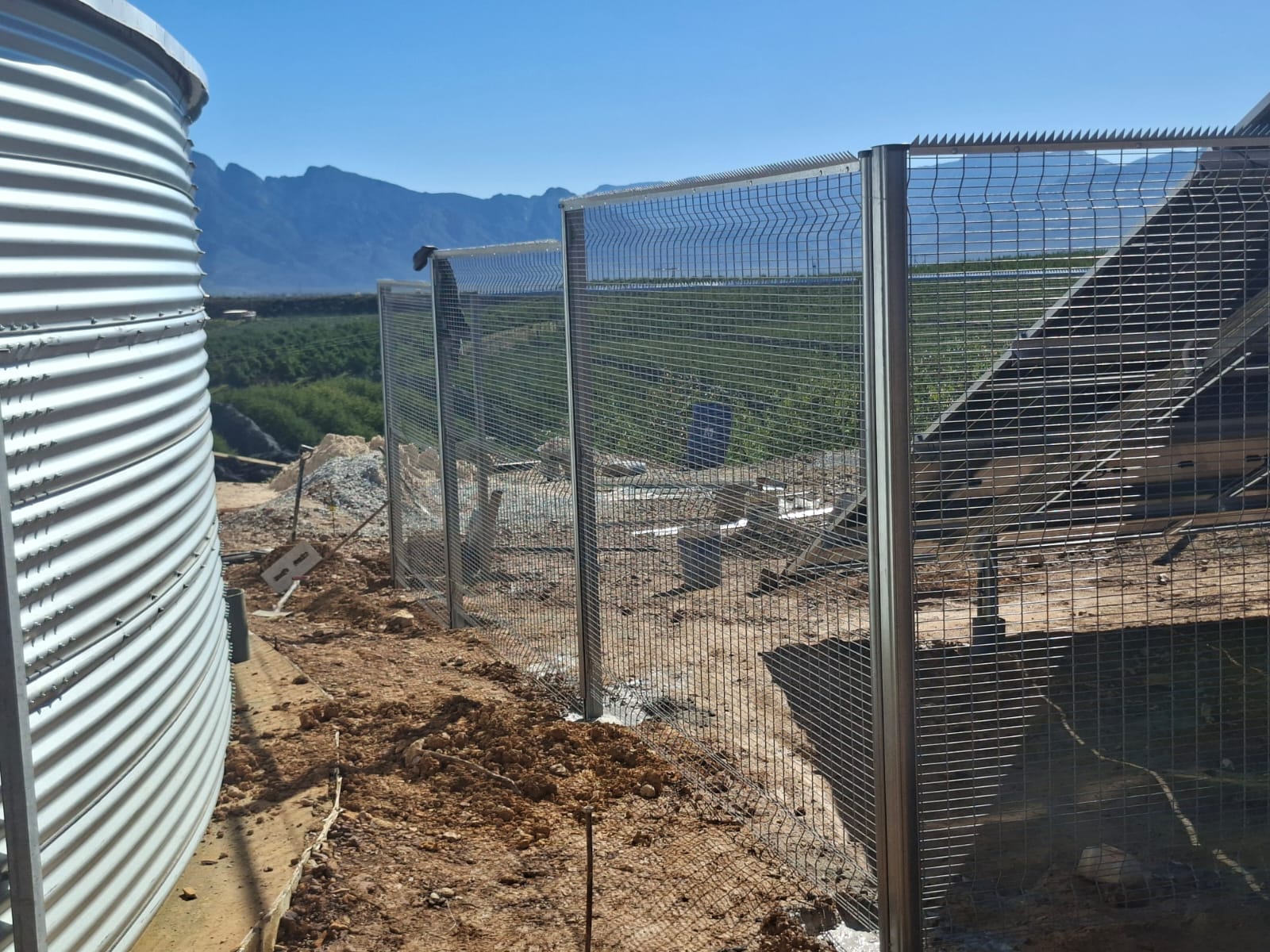 ClearView corners around solar panels and a farm water tank